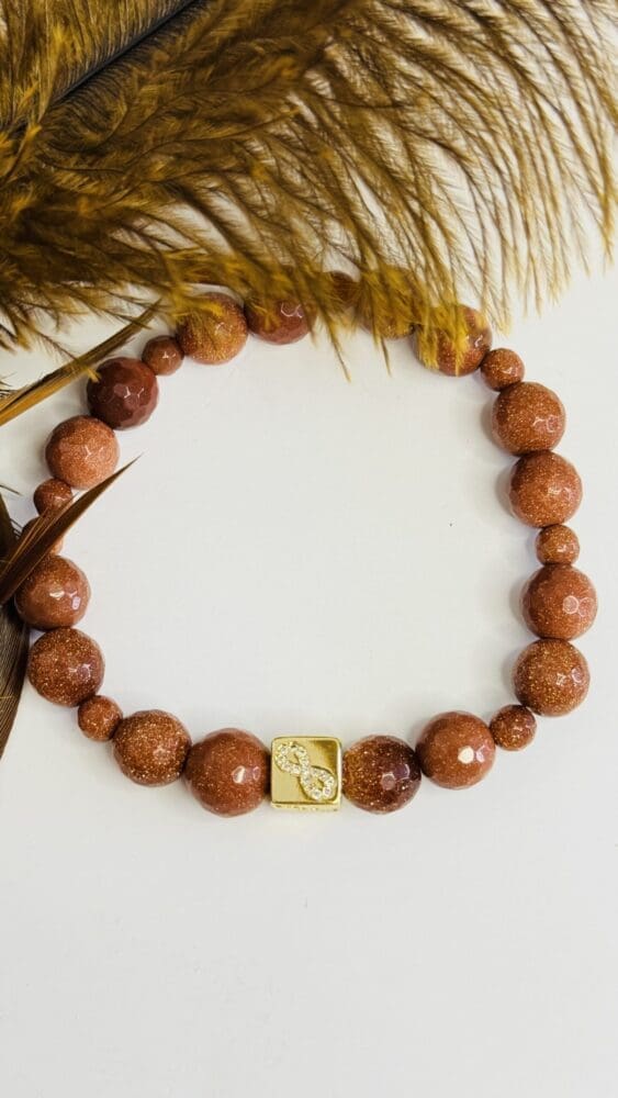 Goldstone with Gold Square Love Bead