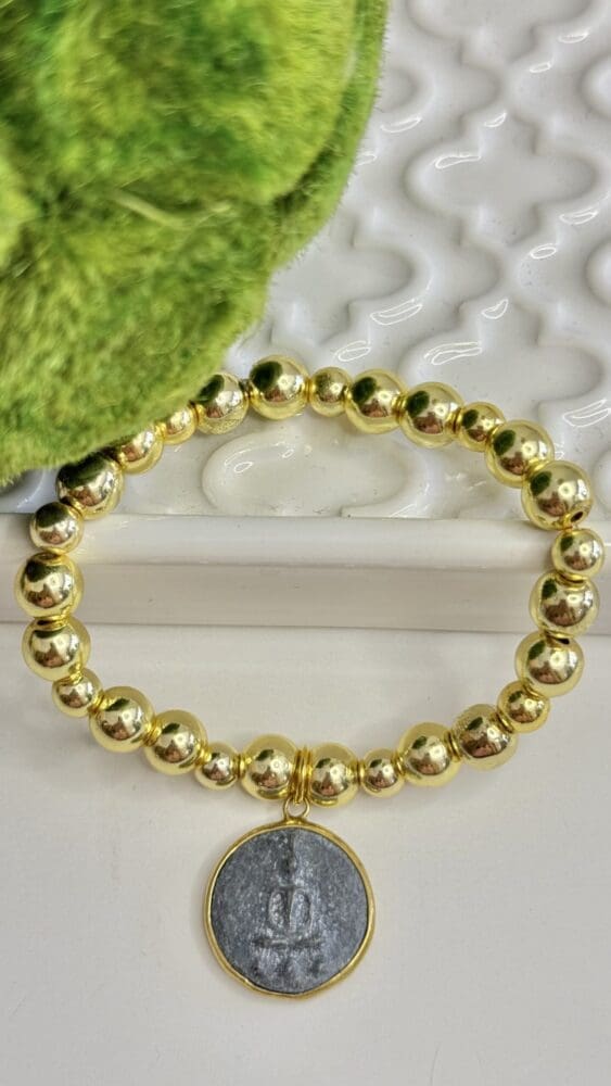 Hematite with Tibetan Charm