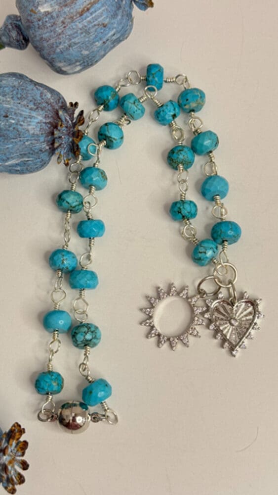 Faceted Turquoise, Wire Wrapped with Micro Pave Heart and Sun Pendant